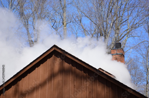Fotografering Steam billowing from a maple syrup sugar shack