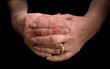 © Linda Bestwick - Close up of a pensioners hands with fingers interlaced.