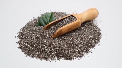 Wall Mural - Chia seeds in scoop on white background