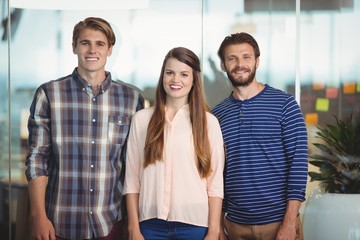 Wall Mural - Happy executives standing in office