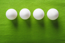 White Eggs On A Green Fabric Texture Background