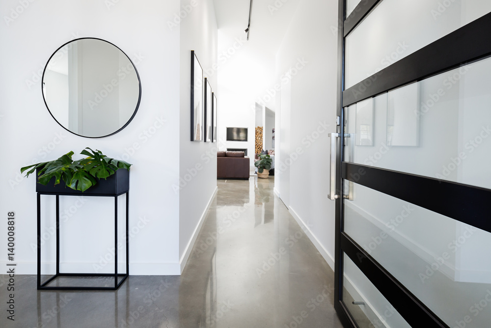 Contemporary home entry with polished concrete floors - obrazy, fototapety, plakaty 