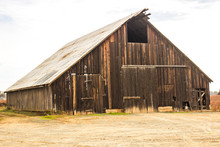 Abandoned Wood Barn With Tin Roof