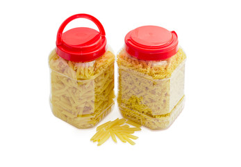 Two various pasta in two plastic containers with red covers