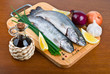 Fresh raw fish trout on wooden board