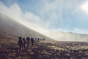 Wall Mural - hikers on the trail in the Islandic mountains. Trek in National Park Landmannalaugar, Iceland. valley is in fog