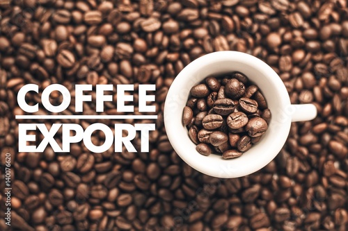 Fotografie, Obraz Cup full of coffee beans on a blurred coffee bean background and message "Coffee