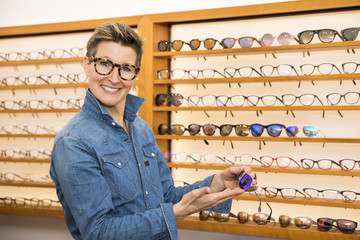 Wall Mural - woman in a eyewear store