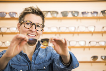 Wall Mural - woman in a eyewear store