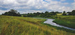 © valeriy boyarskiy - Cloudy countryside landscape with small river and abandoned house