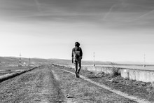 Man Walking On A Country Road