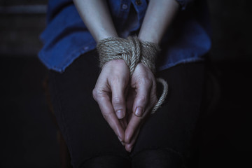 Wall Mural - Helpless young woman with her hands tied