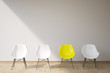Three white chairs and a yellow one