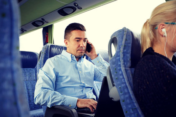 Poster - man with smartphone and laptop in travel bus