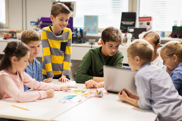 Wall Mural - happy children with laptop at robotics school