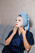 © Parilov - The girl puts and corrects a nutritious mask on a skin. Acne