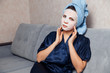 © Parilov - The girl applies and corrects the nourishing mask on the skin. Mask for rejuvenating and eliminating skin defects. Acne, acne.