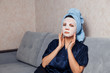 © Parilov - The girl applies and corrects the nourishing mask on the skin. Mask for rejuvenating and eliminating skin defects. Acne, acne.