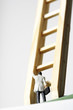 © STOCK4B  - Businessman figurine in front of a ladder