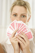 © STOCK4B  - Woman covering her face with cards