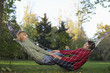 © STOCK4B  - Teenage couple in a hammock, selective focus