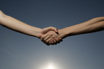 Two women shaking hands