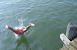 © STOCK4B  - Boy jumping into Water from a wooden Footbridge - Saltation - Fun - Summer - Swimming