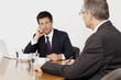 © STOCK4B  - Two businessmen talking in conference room, Munich, Bavaria, Germany