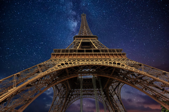 the eiffel tower at night in paris, france