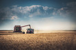 Combine harvester agriculture machine harvesting golden ripe wheat field