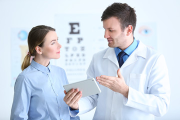 Wall Mural - Woman visiting male ophthalmologist in clinic