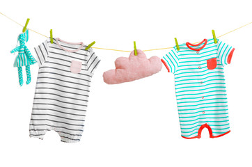 Wall Mural - Baby clothes hanging on white background