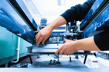 Worker setting print screening metal machine