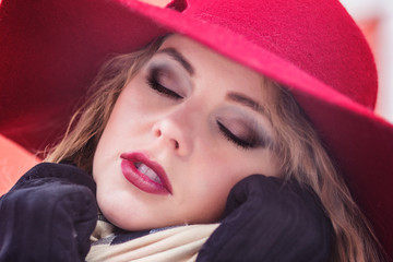 Girl in a hat on the street