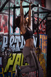 © .shock - black woman doing pull ups