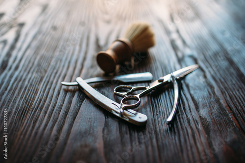 Fotografie, Obraz Shaving and barber equipment on wooden background