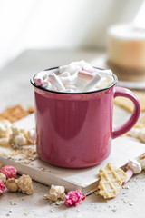 Wall Mural - a delicious Cup of cocoa with colorful marshmallows