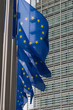 Row of EU European Union flags flying in front of administrative building at the EU headquarters in Brussels, Belgium