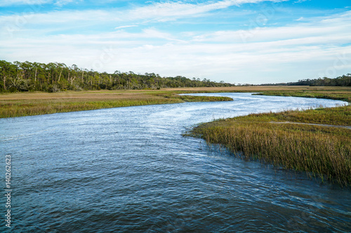 Fotografía a protected water inlet on an island is being re-introduced with clams in a cons