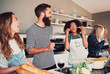 © Flamingo Images - Four friends playing with food while cooking