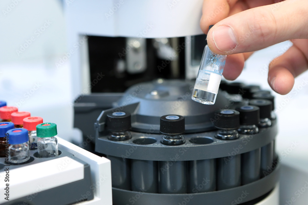 People hand holding a test tube vial sets for analysis in the gas ...