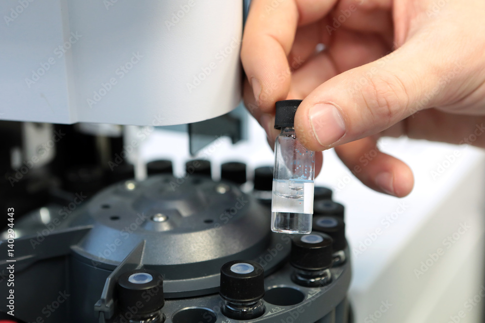 People hand holding a test tube vial sets for analysis in the gas ...
