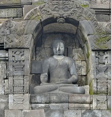 Borobudur Buddist Temple in island Java Indonesia. Detail of Buddhist carved relief in Borobudur temple in Yogyakarta, Java, Indonesia..