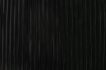 black pleated fabric. plisse fabric background texture.