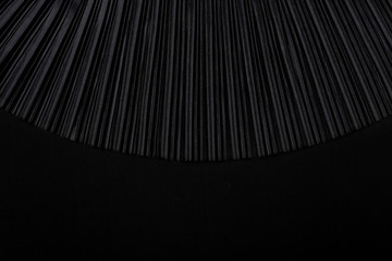 black pleated fabric with empty place. plisse fabric texture background.