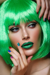 Wall Mural - Beautiful girl in green wig