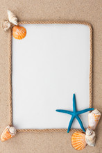 Beautiful Frame Of Rope And Star And Sea Shells With A White Background On The Sand