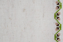 Texture Of Beige Linen Fabric With Embroidery.