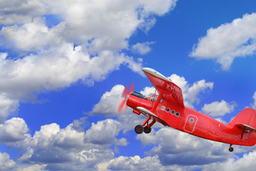 Red airplane biplane with piston engine