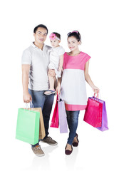 Wall Mural - Happy family shopping together